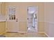 Utility room features an exterior door and leads to a large storage room at 940 New Hope Rd, Fayetteville, GA 30214