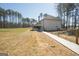 Back exterior view showcasing the home's fenced yard, and walking path at 337 Paynes Lake Rd, Carrollton, GA 30116
