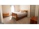 Well-lit bedroom features a bed with soft gray linens and neutral walls at 337 Paynes Lake Rd, Carrollton, GA 30116