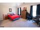Cozy bedroom features a bed with a baseball-themed comforter and curtains at 337 Paynes Lake Rd, Carrollton, GA 30116