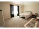 Spacious bedroom with neutral carpet, black-out curtains, and plenty of room at 337 Paynes Lake Rd, Carrollton, GA 30116