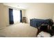 Spacious bedroom featuring a desk and rocking chair next to the bed at 337 Paynes Lake Rd, Carrollton, GA 30116