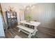 Dining room features a large table with bench seating and a china cabinet at 337 Paynes Lake Rd, Carrollton, GA 30116
