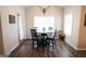 Bright breakfast nook with round table and chairs next to a rear exterior door at 337 Paynes Lake Rd, Carrollton, GA 30116