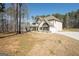 Expansive lot featuring a well-maintained yard and a spacious driveway leading to the house at 337 Paynes Lake Rd, Carrollton, GA 30116