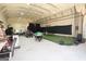 The spacious garage features batting cage, gym equipment, and ample storage area at 337 Paynes Lake Rd, Carrollton, GA 30116