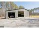 Metal garage with two large doors, providing ample space for vehicles and equipment storage at 337 Paynes Lake Rd, Carrollton, GA 30116