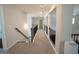 Upstairs hallway with carpet, railing, and natural light at 337 Paynes Lake Rd, Carrollton, GA 30116