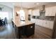 Modern kitchen with a center island, stainless steel appliances, and herringbone backsplash at 337 Paynes Lake Rd, Carrollton, GA 30116