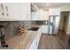 Modern kitchen featuring stainless steel appliances, granite countertops, and modern fixtures at 337 Paynes Lake Rd, Carrollton, GA 30116