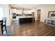 Modern kitchen with white cabinets, stainless steel appliances, and a large island at 337 Paynes Lake Rd, Carrollton, GA 30116