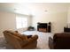 Comfortable living room with plush seating, large window, and entertainment center at 337 Paynes Lake Rd, Carrollton, GA 30116