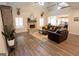Open-concept living room featuring hardwood floors and a fireplace at 337 Paynes Lake Rd, Carrollton, GA 30116