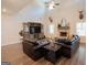 Bright living room featuring hardwood floors, a brick fireplace, and vaulted ceilings at 337 Paynes Lake Rd, Carrollton, GA 30116