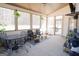 Outdoor porch with black metal patio furniture and ceiling fan at 337 Paynes Lake Rd, Carrollton, GA 30116
