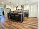 Open kitchen with a large island, modern cabinets, and stainless steel appliances at 170 Royal Ridge Way, Fayetteville, GA 30215