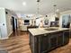 Open-concept kitchen featuring a large island and seamless flow to living spaces at 170 Royal Ridge Way, Fayetteville, GA 30215