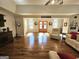 Bright and airy living room with hardwood floors, a vaulted ceiling, and a view of the front entryway at 170 Royal Ridge Way, Fayetteville, GA 30215