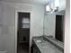 Bathroom featuring granite countertops, modern lighting, and white fixtures at 676 Bralorne Dr, Stone Mountain, GA 30087