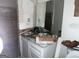 Bathroom vanity with a white countertop and a mirror, surrounded by debris and construction materials at 676 Bralorne Dr, Stone Mountain, GA 30087