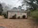 Exterior view of brick home with mature landscaping at 676 Bralorne Dr, Stone Mountain, GA 30087