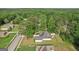 An aerial view shows the home's backyard, detached garage, and surrounding tree coverage at 2768 Southpark Sw Blvd, Conyers, GA 30094