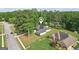 Aerial view of the home with a well-maintained lawn in a quiet neighborhood at 2768 Southpark Sw Blvd, Conyers, GA 30094