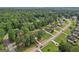 Aerial view of suburban neighborhood featuring well-maintained lawns and mature trees at 2768 Southpark Sw Blvd, Conyers, GA 30094