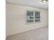 Sunlit bedroom features plush carpeting, neutral walls, and a bright window at 2768 Southpark Sw Blvd, Conyers, GA 30094
