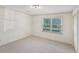 Bright bedroom featuring a window overlooking the green outdoors and a spacious closet at 2768 Southpark Sw Blvd, Conyers, GA 30094