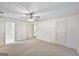 Spacious bedroom with neutral carpet, ceiling fan, and ensuite bathroom at 2768 Southpark Sw Blvd, Conyers, GA 30094