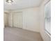Bedroom boasts neutral walls, plush carpeting, a window, and a closet with white doors at 2768 Southpark Sw Blvd, Conyers, GA 30094