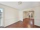 Dining room features wood-look flooring and a view into another room with chandelier lighting at 2768 Southpark Sw Blvd, Conyers, GA 30094