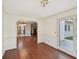 Bright dining room featuring wood floors, white walls, and an entrance to the outside at 2768 Southpark Sw Blvd, Conyers, GA 30094