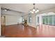 The living room flows into a space with sliding doors and features a brick fireplace at 2768 Southpark Sw Blvd, Conyers, GA 30094