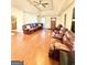 Large living room with wood floors, fan and recessed lights at 2768 Southpark Sw Blvd, Conyers, GA 30094