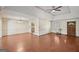 Spacious living room with a brick fireplace, wood-look floors, and entrance to the kitchen at 2768 Southpark Sw Blvd, Conyers, GA 30094