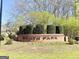 Community sign for South Park, with manicured bushes and healthy green grass on a sunny day at 2768 Southpark Sw Blvd, Conyers, GA 30094