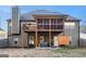 Back exterior view featuring a deck, hot tub, grey siding and meticulously maintained lawn at 6 Water Oak Dr, Sharpsburg, GA 30277