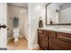 Clean bathroom featuring tile flooring, a vanity with a mirror and a shower behind a curtain at 6 Water Oak Dr, Sharpsburg, GA 30277