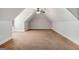 Expansive bonus room with carpet flooring, neutral walls, and a ceiling fan for added comfort at 6 Water Oak Dr, Sharpsburg, GA 30277