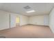 Large basement space with neutral carpet, recessed lighting and bright walls at 225 Chinns Way, Hampton, GA 30228