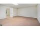 Basement space with neutral carpet, a brick accent wall and recessed lighting at 225 Chinns Way, Hampton, GA 30228