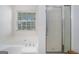 Bathroom featuring a soaking tub and a glass-enclosed shower at 225 Chinns Way, Hampton, GA 30228