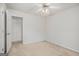 Bedroom with neutral carpet, a ceiling fan, and a closet at 225 Chinns Way, Hampton, GA 30228