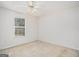 Cozy bedroom with neutral tones and a window offering natural light at 225 Chinns Way, Hampton, GA 30228