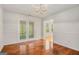 Dining room featuring hardwood floors and french doors at 225 Chinns Way, Hampton, GA 30228