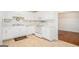 Well-lit kitchen featuring white cabinets and ample counter space at 225 Chinns Way, Hampton, GA 30228