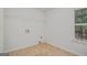 Well-lit laundry room features tile floor and a window at 225 Chinns Way, Hampton, GA 30228