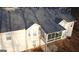 Charming home featuring a cozy sunroom with large windows and a neutral paint palette at 225 Chinns Way, Hampton, GA 30228